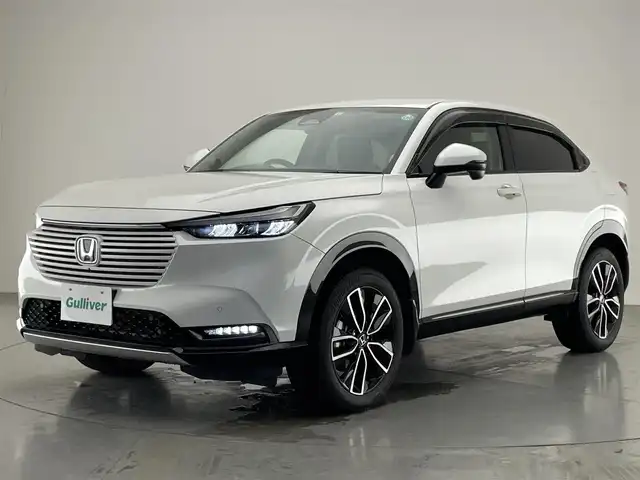 ホンダ ヴェゼル ハイブリッド e:HEV Z 愛知県 2022(令4)年 2.1万km プラチナホワイトパール Honda SENSING/純正9インチワイドディスプレイナビ/　AM FM Bluetooth AppleCarPlay AndroidAuto/フルセグTV/ビルトインETC2.0/レーダークルーズコントロール/全方位カメラ/ドライブレコーダー/置くだけ充電/BSM/LEDオートヘッドライト/シーケンシャルターンランプ/デジタルインナーミラー/ハーフレザーシート/シートヒーター(前席)/パワーバックドア/純正18インチアルミホイール/スマートキー2本/ワンオーナー