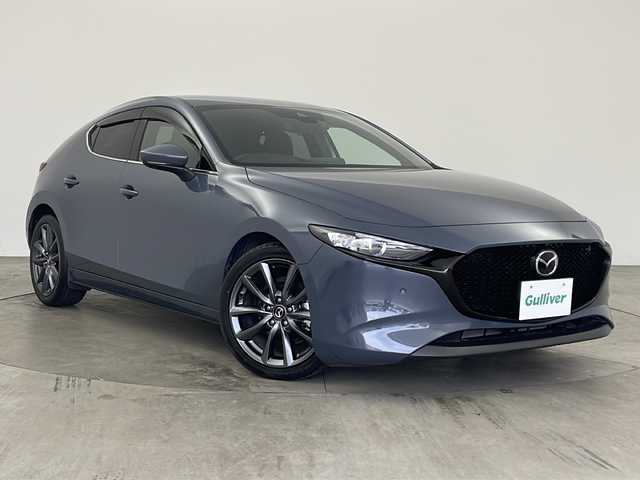 マツダ マツダ３ファストバック 15S ツーリング 兵庫県 2019(令1)年 2.1万km ポリメタルグレーM ・純正ナビ/CD/DVD/BT/USB/HDMI/TV/・アラウンドビューモニター/・i-ACTIVSENSE/・スマートブレーキサポート/・レーンキープアシスト/・ブラインドスポットモニター/・クリアランスソナー/・レーダークルーズコントロール/・アイドリングストップ/・電動パーキング/・オートホールド/・前方ドライブレコーダー/・LEDオートライト/・オートマチックハイビーム/・純正フロアマット/・革巻きステアリング/・ステアリングスイッチ/・ビルトインETC/・純正アルミホイール/・スマートキー/・スペアキー/・プッシュスタート