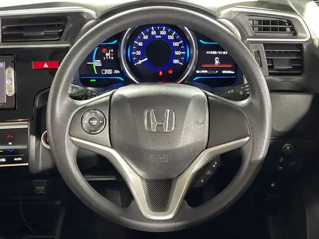 ホンダ フィット ハイブリット Fパッケージ 福岡県 2013(平25)年 9.1万km ビビットスカイブルーP ・純正7インチナビ/（CD、DVD、ワンセグ、Bluetooth）/・バックカメラ/・プッシュスタート/・ステアリングスイッチ/・ヘッドライトリベライザー/・ドライブレコーダー/・ETC/・電格ミラー/・ウィンカーミラー