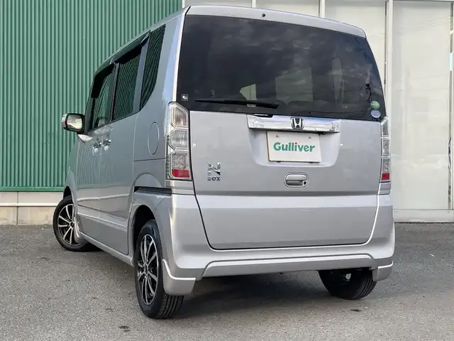 ホンダ Ｎ ＢＯＸ G ターボ Lパッケージ 福岡県 2015(平27)年 5.1万km カトラリーシルバーM Gathers7型ナビ/（BT/フルセグ/DISC/AM/FM/SD/iPod)/Bカメラ/片側パワースライドドア/クルーズコントロール/ベンチシート/チップアップシート/アルミホイール/パドルシフト/シートカバー/横滑り防止装置/盗難防止装置/スマートキー/ETC