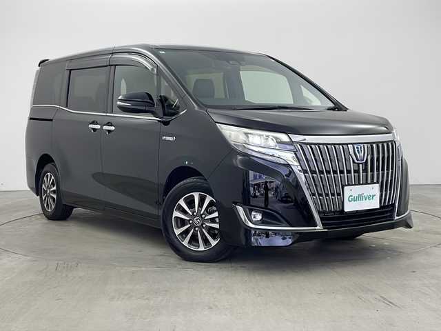 トヨタ エスクァイア ハイブリッド Gi 兵庫県 2018(平30)年 1.6万km ブラック ・純正9インチナビ（NSZT-Y68T）/CD/DVD/SD/Bluetooth/TV/・バックカメラ/・ビルトインETC/・純正ドライブレコーダー/・合成皮革シート/・前席シートヒーター/・両側パワースライドドア/・クルーズコントロール/・Toyota　Safety　Sense/・プリクラッシュセーフティ/・レーンディパーチャーアラート/・オートマチックハイビーム/・先行車発進告知機能/・純正ウッドコンビステアリング/・ＬＥＤヘッドライト/・ＬＥＤフォグランプ/・スマートキー/・プッシュスタート/・TRC