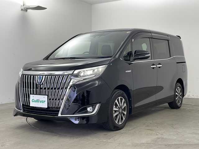 トヨタ エスクァイア ハイブリッド Gi 兵庫県 2018(平30)年 1.6万km ブラック ・純正9インチナビ（NSZT-Y68T）/CD/DVD/SD/Bluetooth/TV/・バックカメラ/・ビルトインETC/・純正ドライブレコーダー/・合成皮革シート/・前席シートヒーター/・両側パワースライドドア/・クルーズコントロール/・Toyota　Safety　Sense/・プリクラッシュセーフティ/・レーンディパーチャーアラート/・オートマチックハイビーム/・先行車発進告知機能/・純正ウッドコンビステアリング/・ＬＥＤヘッドライト/・ＬＥＤフォグランプ/・スマートキー/・プッシュスタート/・TRC