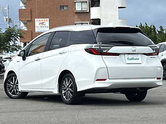 ホンダ シャトル ハイブリッド Z ホンダセンシング 山口県 2019(令1)年 3.1万km プラチナホワイトパール 禁煙車/ワンオーナー/純正メモリナビ/フルセグTV/CD/DVD/FM/AM/SD/BT/USB/AUX/バックカメラ/ルーフレール/ビルトインETC/横滑り防止/標識認識機能/先行車発進お知らせ/プッシュスタート/前席シートヒーター/革巻きステアリング/ステアリングスイッチ/パドルシフト/オートリトラウィンカーミラー/フォグランプ/リアワイパー/オートハイビーム/アルミペダル/純正サイドスポイラー/ISOFIX/保証書/取扱説明書/スマートキー