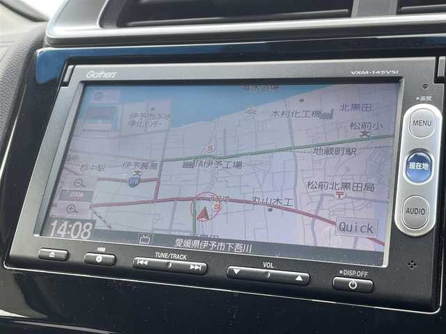 ホンダ フィット ハイブリット Fパッケージ 愛媛県 2014(平26)年 5.6万km プレミアムホワイトパール バックカメラ/LED/オートライト/Bluetooth/USB/カーテンエアバッグ/純正フロアマット/スマートキー/ワンセグTV/プッシュスタート/パワーステアリング/パワーウィンドウ/AAC/CD/SDナビ/DVD/ABS/横滑り防止装置/衝突被害軽減システム