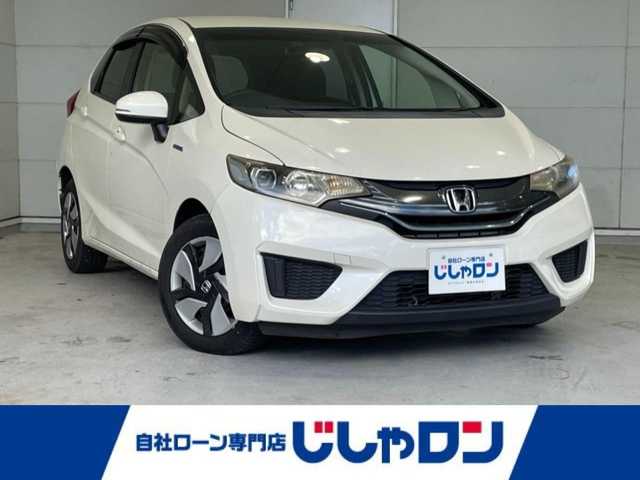 ホンダ フィット ハイブリット Fパッケージ 沖縄県 2015(平27)年 6.8万km プレミアムホワイトパール (株)IDOMが運営する【じしゃロンコザ店】の自社ローン専用車両になりますこちらは現金またはオートローンご利用時の価格です。自社ローンご希望の方は別途その旨お申付け下さい/・純正ナビ/・バックカメラ/・Bluetooth接続/・DVD再生/・TV/・ETC/・ドライブレコーダー/・スマートキー/・プッシュスタート/・純正フロアマット/・オートライト