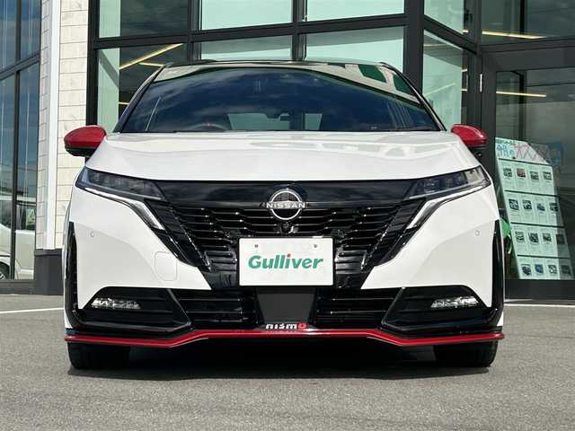 日産 オーラ ニスモ 愛媛県 2022(令4)年 2.3万km ピュアホワイトパール / スーパーブラック 2トーン NissanConnect9型ワイドディスプレイ/全方位カメラ/プロパイロット(ナビリンク機能付)/プロパイロット緊急停止支援システム/AppleCarPlay/AndroidAuto/BT/フルセグTV/HDMI入力端子/USB入力端子/インテリジェントルームミラー/後側方車両検知警報(BSW)/クリアランスソナー/ワイヤレス充電/ステアリングヒーター/D/N席シートヒーター/前後ドライブレコーダー/NISMOサイドロアガーニッシュ/NISMOリヤバンパ―ガーニッシュ/NISMOフロントリップスポイラー/NISMO専用シート/NISMOドアプロテクター/現状サマー(純正AW)(205/50/ZR17)/MICHELIN PILOT SPORT4