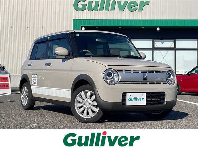 スズキ ラパン X 島根県 2022(令4)年 5.6万km フォーンベージュM 社外7インチメモリナビゲーション(KXM-E506W2)/スズキセーフティサポート/社外前方ドライブレコーダー/D/N席シートヒーター/AUTOライト/LEDヘッドライト/コーナーセンサー/ステアリングリモコン/アイドリングストップ/純正14インチアルミホイール