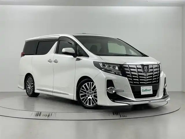 トヨタ アルファード S Cパッケージ 埼玉県 2015(平27)年 4.1万km ホワイトパールクリスタルシャイン 純正ナビ/（フルセグＴＶ・ＡＭ・ＦＭ・Ｂｌｕｅｔｏｏｔｈ）/全方位カメラ/後席フリップダウンモニター/モデリスタエアロ/ムーンルーフ/ビルトインETC/JBLサウンド/パワースライドドア（両側）/レーダークルーズコントロール/コーナーセンサー/パワーバックドア/LEDヘッドランプ/オートライト/フォグランプ/純正18インチアルミ/木目調/革巻きステアリングホイール/ステアリングヒーター/前後左右独立オートエアコン/革シート/シートヒーター/パワーシート/スマートエントリー/禁煙車