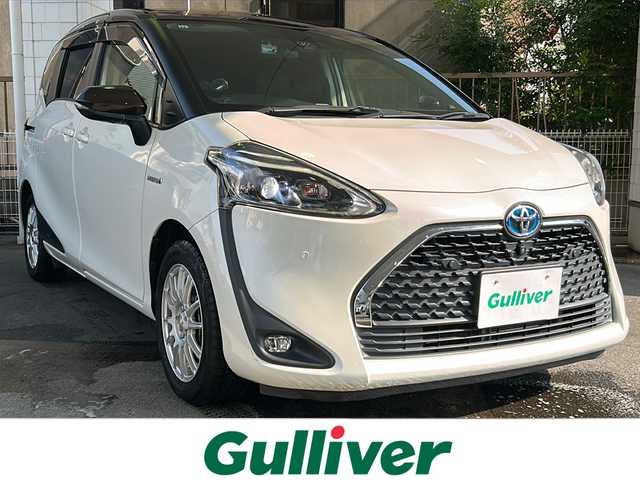 トヨタ シエンタ ハイブリッド G クエロ 京都府 2019(令1)年 7.3万km ヴィンテージブラウンパールクリスタルシャイン/ホワイトパールクリスタルシャイン 純正SDナビ /フルセグTV /トヨタセーフティセンス　/全方位カメラ　/フリップダウンモニター　/禁煙車　/両側パワスラ　/前後コーナーセンサー　/ビルトインETC2.0　/2トーン　/LEDヘッドライト/クーズコントロール/スマートキー/ハーフレザー/前席シートヒーター/前方社外ドライブレコーダー/　CSD-790FHG/（CSD-790FHG)/ウインカーミラー/アイドリングストップ/Bluetooth/CD再生機能/ウォークスルー/AW15インチ/（GRASS）/スタッドレスタイヤ/横滑り防止/レーンキープアシスト/盗難防止装置/オートライト/オートマチックハイビーム/Wエアバッグ