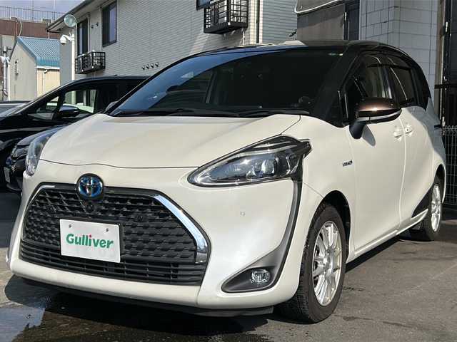 トヨタ シエンタ ハイブリッド G クエロ 京都府 2019(令1)年 7.3万km ヴィンテージブラウンパールクリスタルシャイン/ホワイトパールクリスタルシャイン 純正SDナビ /フルセグTV /トヨタセーフティセンス　/全方位カメラ　/フリップダウンモニター　/禁煙車　/両側パワスラ　/前後コーナーセンサー　/ビルトインETC2.0　/2トーン　/LEDヘッドライト/クーズコントロール/スマートキー/ハーフレザー/前席シートヒーター/前方社外ドライブレコーダー/　CSD-790FHG/（CSD-790FHG)/ウインカーミラー/アイドリングストップ/Bluetooth/CD再生機能/ウォークスルー/AW15インチ/（GRASS）/スタッドレスタイヤ/横滑り防止/レーンキープアシスト/盗難防止装置/オートライト/オートマチックハイビーム/Wエアバッグ