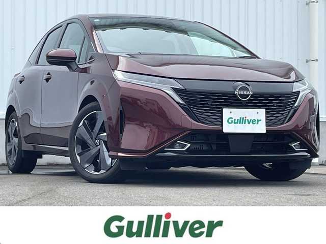 日産 オーラ G レザーエディション 愛媛県 2023(令5)年 0.7万km バーガンディー 純正9型ナビ/AM/FM/BT/フルセグTV/全周囲カメラ　/ブラインドスポットモニター　/インテリジェントルームミラー　/ドライブレコーダー　/ステアリングリモコン　/LEDヘッドライト　/前後コーナーセンサー　/電動パーキングブレーキ　/ETC/レザーシート/シガーソケット/ISOFIX/SPORT/ECO/NORMAL/EVモード/現状サマー(純正AW)(205/50/R17)/BRIDGESTONE TURANZA T005A