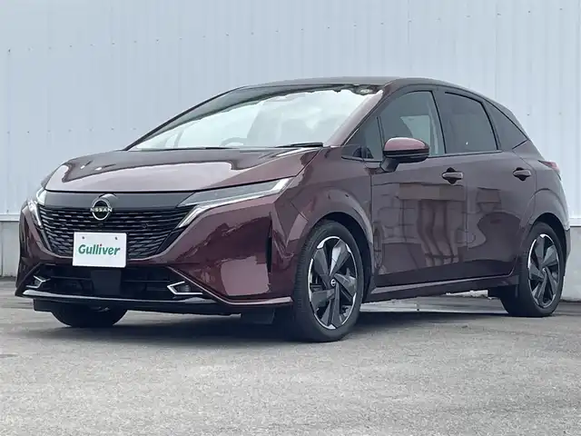 日産 オーラ G レザーエディション 愛媛県 2023(令5)年 0.7万km バーガンディー 純正9型ナビ/AM/FM/BT/フルセグTV/全周囲カメラ　/ブラインドスポットモニター　/インテリジェントルームミラー　/ドライブレコーダー　/ステアリングリモコン　/LEDヘッドライト　/前後コーナーセンサー　/電動パーキングブレーキ　/ETC/レザーシート/シガーソケット/ISOFIX/SPORT/ECO/NORMAL/EVモード/現状サマー(純正AW)(205/50/R17)/BRIDGESTONE TURANZA T005A