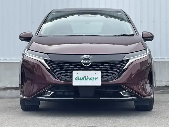 日産 オーラ G レザーエディション 愛媛県 2023(令5)年 0.7万km バーガンディー 純正9型ナビ/AM/FM/BT/フルセグTV/全周囲カメラ　/ブラインドスポットモニター　/インテリジェントルームミラー　/ドライブレコーダー　/ステアリングリモコン　/LEDヘッドライト　/前後コーナーセンサー　/電動パーキングブレーキ　/ETC/レザーシート/シガーソケット/ISOFIX/SPORT/ECO/NORMAL/EVモード/現状サマー(純正AW)(205/50/R17)/BRIDGESTONE TURANZA T005A