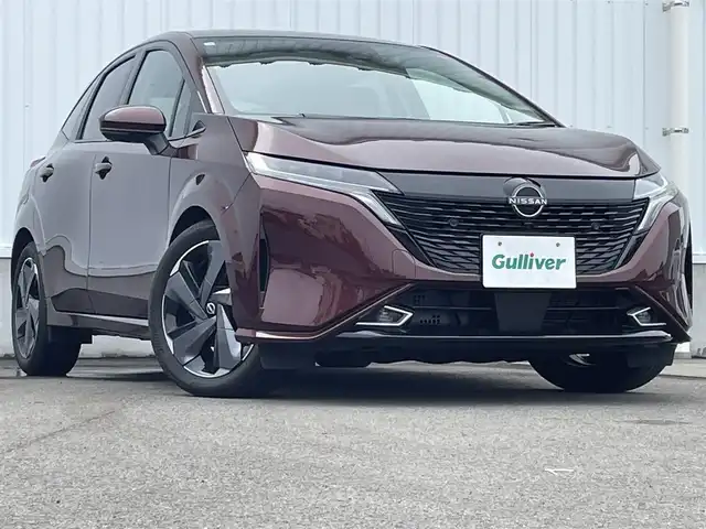 日産 オーラ G レザーエディション 愛媛県 2023(令5)年 0.7万km バーガンディー 純正9型ナビ/AM/FM/BT/フルセグTV/全周囲カメラ　/ブラインドスポットモニター　/インテリジェントルームミラー　/ドライブレコーダー　/ステアリングリモコン　/LEDヘッドライト　/前後コーナーセンサー　/電動パーキングブレーキ　/ETC/レザーシート/シガーソケット/ISOFIX/SPORT/ECO/NORMAL/EVモード/現状サマー(純正AW)(205/50/R17)/BRIDGESTONE TURANZA T005A