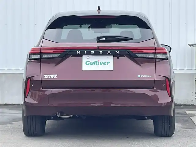 日産 オーラ G レザーエディション 愛媛県 2023(令5)年 0.7万km バーガンディー 純正9型ナビ/AM/FM/BT/フルセグTV/全周囲カメラ　/ブラインドスポットモニター　/インテリジェントルームミラー　/ドライブレコーダー　/ステアリングリモコン　/LEDヘッドライト　/前後コーナーセンサー　/電動パーキングブレーキ　/ETC/レザーシート/シガーソケット/ISOFIX/SPORT/ECO/NORMAL/EVモード/現状サマー(純正AW)(205/50/R17)/BRIDGESTONE TURANZA T005A