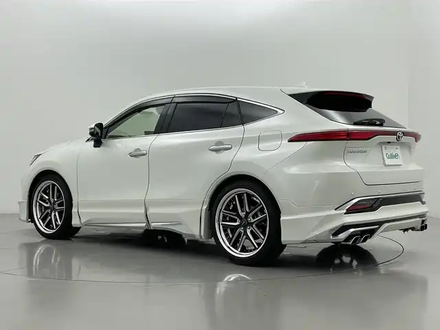 トヨタ ハリアー Z レザーパッケージ 熊本県 2022(令4)年 4.1万km ホワイトパールクリスタルシャイン モデリスタエアロフル/JBLサウンド/純正ナビ（ApplCarPlay・AndroidAuto・BT・フルセグ・USB）　/全周囲カメラ　/ビルトインＥＴＣ２．０　/前後クリアランスソナー　/録画機能付きデジタルインナーミラー/トヨタセーフティーセンス/・レーンキープアシスト/・ロードサインアシスト/・アダブティブクルーズコントロール/・オートマチックハイビーム/・駐車時支援パーキングサポートシステム/・ブラインドスポットモニター/・リアクロストラフィックアラート/・先行車発進お知らせ機能/・ヘッドアップディスプレイ/横滑り防止/前席シートヒーター/ステアリングヒーター　/前席エアーシート　/前席パワーシート/運転席シートメモリー/パワーバックドア/ＢＬＩＴＺ車高調/電動パーキングサポート/ブレーキホールド/レザーシート/社外フロアマット/社外２１インチAW/オートライト/LEDヘッドライト/フォグランプ/スマートキー/プッシュスタート/スペアキー/保証書/取扱説明書/