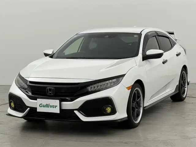 ホンダ シビック ハッチバック ホンダセンシング 福岡県 2018(平30)年 8.4万km ホワイトオーキッドパール 社外ディスプレイオーディオ／バックカメラ　/デジタルルームミラー　/ビルトインＥＴＣ　/前後ドラレコ　/アダプティブクルコン　/衝突軽減ブレーキ　/レーンキープ　/シートヒーター　/純正１８インチＡＷ　/リアスポイラー　/ＬＥＤヘッドライト