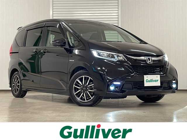 ホンダ フリード ハイブリット モデューロX ホンダセンシング 熊本県 2019(平31)年 2.3万km プレミアムスパークルブラックパール 純正ナビ（ラジオ、フルセグ、BT、CD、DVD、SD）/純正フリップダウン/ETC/ドライブレコーダー/レーダークルーズコントロール/ステアリングリモコン/両側パワスラ/バックカメラ/レーンキープ/横滑り防止/オートライト/リアサンシェード/フロアマット/ドアバイザー/プッシュスタート/スマートキー