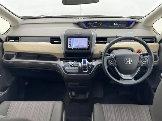 ホンダ フリード ハイブリット G ホンダセンシング 千葉県 2019(令1)年 3.4万km プレミアムスパークルブラックパール 純正7型SDナビ/フルセグTV/Bluetooth/CD/DVD/バックカメラ/USB入力端子/両側電動スライドドア/レーダークルーズコントロール/ホンダセンシング/誤発進抑制機能/歩行者事故低減ステアリング/車線維持支援システム/路外逸脱抑制機能/先行車発進お知らせ機能/標識認識機能/LEDヘッドライト/ビルトインETC/ウィンカーミラー/ウォークスルー/社外フロアマット/ロールサンシェード/プラズマクラスター/コンフォートビューパッケージ/ヒーテッドドアミラー/ワイパーデアイサー