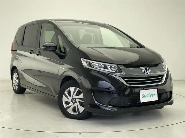 ホンダ フリード ハイブリット G ホンダセンシング 千葉県 2019(令1)年 3.4万km プレミアムスパークルブラックパール 純正7型SDナビ/フルセグTV/Bluetooth/CD/DVD/バックカメラ/USB入力端子/両側電動スライドドア/レーダークルーズコントロール/ホンダセンシング/誤発進抑制機能/歩行者事故低減ステアリング/車線維持支援システム/路外逸脱抑制機能/先行車発進お知らせ機能/標識認識機能/LEDヘッドライト/ビルトインETC/ウィンカーミラー/ウォークスルー/社外フロアマット/ロールサンシェード/プラズマクラスター/コンフォートビューパッケージ/ヒーテッドドアミラー/ワイパーデアイサー