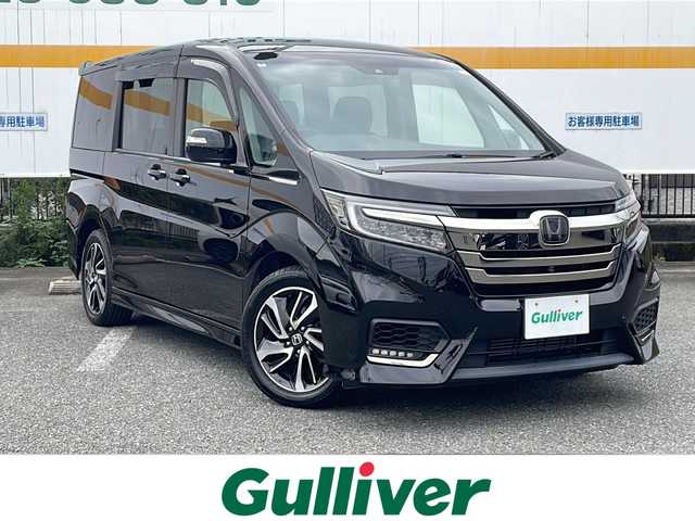 ホンダ ステップワゴン スパーダ クルスピセンシング 山口県 2018(平30)年 5.1万km プレミアムスパークルブラックパール 純正９インチナビ/DVD/CD/SD/BT/USB/フルセグTV/全周囲カメラ/フリップダウンモニター/両側パワースライドドア/ハーフレザーシート/前席シートヒーター/純正LEDヘッドライト/純正１７インチアルミホイール/革巻きステアリング/ステアリングスイッチ/パドルシフト/クルーズコントロール/衝突被害軽減ブレーキ/LKA/横滑り防止/アイドリングストップ/スマートキー/純正フロアマット/純正ドアバイザー/ビルトインETC/ドライブレコーダー/電動格納ウインカードアミラー