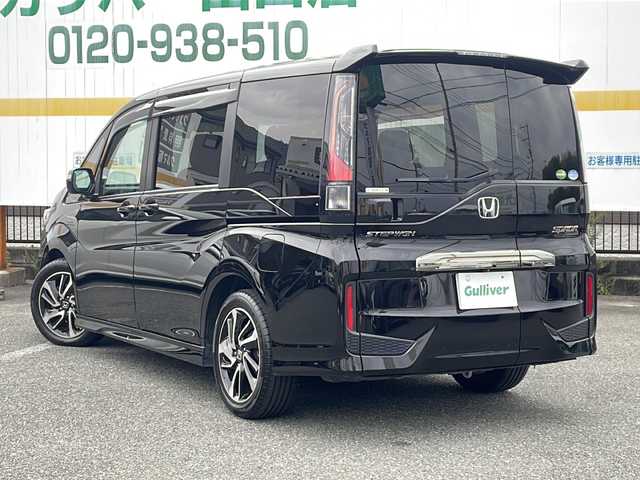 ホンダ ステップワゴン スパーダ クルスピセンシング 山口県 2018(平30)年 5.1万km プレミアムスパークルブラックパール 純正９インチナビ/DVD/CD/SD/BT/USB/フルセグTV/全周囲カメラ/フリップダウンモニター/両側パワースライドドア/ハーフレザーシート/前席シートヒーター/純正LEDヘッドライト/純正１７インチアルミホイール/革巻きステアリング/ステアリングスイッチ/パドルシフト/クルーズコントロール/衝突被害軽減ブレーキ/LKA/横滑り防止/アイドリングストップ/スマートキー/純正フロアマット/純正ドアバイザー/ビルトインETC/ドライブレコーダー/電動格納ウインカードアミラー