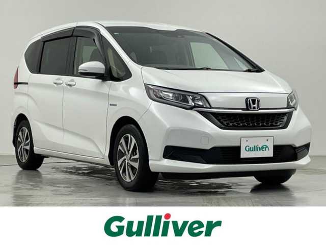 ホンダ フリード＋ ハイブリット G ホンダセンシング 千葉県 2020(令2)年 6.2万km プラチナホワイトパール 純正メモリナビ/バックカメラ/フルセグTV/Bluetooth/衝突被害軽減システム/車線逸脱警報/クルーズコントロール/ハーフレザーシート/両側パワースライドドア/横滑り防止装置/ETC/ドライブレコーダー/アイドリングストップ/LEDヘッドライト/オートライト/ウィンカーミラー/電動格納ミラー/純正15インチAW/シートヒーター/シートリフター/プッシュスタート/スマートキー/フロアマット/ドアバイザー/スペアキー/取扱説明書/保証書