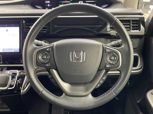 ホンダ ステップワゴン スパーダ eHEV G EXホンダS 岐阜県 2021(令3)年 5.9万km プレミアムスパークルブラックパール 純正10インチメモリナビ/　(AM/FM/CD/DVD/フルセグTV/Bluetooth)/バックカメラ/ホンダセンシング/衝突軽減ブレーキ/レーンキープアシスト/誤発進抑制機能/レーダークルーズコントロール/両側パワースライドドア/ハーフレザーシート/シートヒーター/革巻きハンドル/ビルトインETC2.0/純正ドライブレコーダー/LEDヘッドライト/電動パーキングブレーキ/純正アルミホイール/純正フロアマット/ドアバイザー