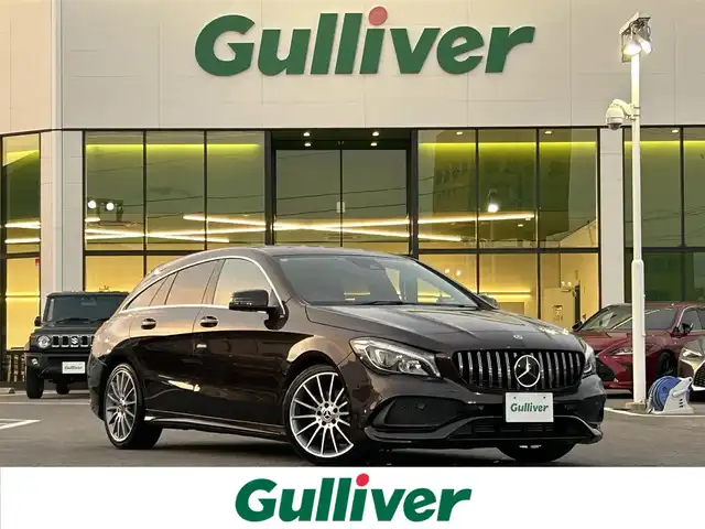 メルセデス・ベンツ ＣＬＡ１８０ Sブレイク AMG スタイル 愛媛県 2018(平30)年 6.7万km 茶 メーカーオプション純正ナビ/BT/AM・FM/CD/DVD/フルセグTV/ETC/前後ドライブレコーダー/ブラインドスポットモニター/前後コーナーセンサー/バックカメラ/レーンキープアシスト/衝突軽減システム/パーキングアシスト/アイドリングストップ/パドルシフト/追従型クルーズコントロール/harman kardonスピーカー/ガラスルーフ/D+N席シートヒーター・パワーシート/純正フロアマット/純正アルミホイール
