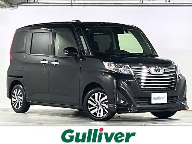 トヨタ ルーミー カスタムG 広島県 2019(令1)年 2.8万km ブラックマイカメタリック 禁煙車/スマートアシスト/・プリクラッシュセーフティ/・LDA/・オートマチックハイビーム/・先行車発進お知らせ/クリアランスソナー/クルーズコントロール/イクリプス７型ナビ（AVN-P9W）/・CD/DVD/DTV/Bluetooth/SD/MUSICJUKE/バックカメラ/両側パワースライドドア/革巻きステアリング/ステアリングスイッチ/オートライト/LEDヘッドライト/フォグランプ/純正ドライブレコーダー（DRT-H68A）/ビルトインETC/スマートキー/プッシュスタート/スペアキー/純正14インチアルミホイール/純正フロアマット/ドアバイザー