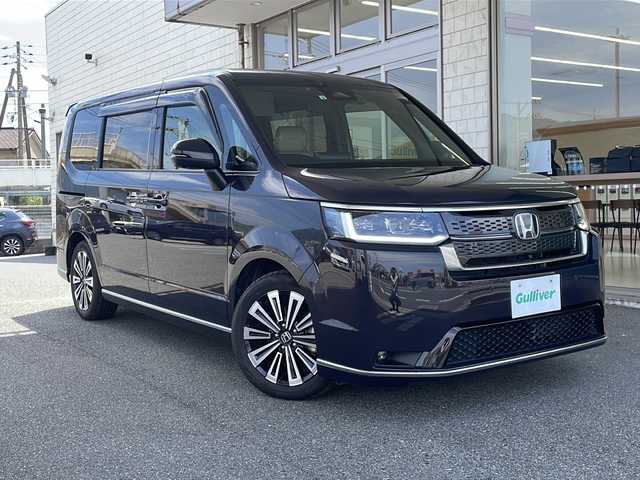 ホンダ ステップワゴン スパーダ eHEV プレミアムライン 山口県 2022(令4)年 3.7万km トワイライトミストブラックパール スマートキー×2/純正11.4型ナビ/フルセグTV/Bluetooth/AppleCarPlay/CD/DVD/全方位カメラ/純正15.6型フリップダウンモニター/ドライブレコーダー（前後）【DRH-229ND】/両側パワースライドドア/シートカバー/D/N席、二列目シートヒーター/パワーバックドア/二列目オットマン/ホンダセンシング/・衝突被害軽減ブレーキ/・アダプティブクルーズコントロール/・レーンキープアシスト/・歩行者事故低減ステアリング/・先行車発進お知らせ機能/・標識認識機能/純正フロアマット/純正１７インチアルミホイール