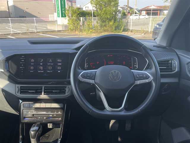 フォルクスワーゲン Ｔ－クロス TSI スタイル 宮崎県 2022(令4)年 3.4万km 黒 純正メモリナビゲーション/・Bluetooth/・社外フルセグテレビ （走行中不可）/・USB/・AM FM/ハーフレザーシート/バックカメラ/・前後コーナーセンサー/アクティブクルーズコントロール/・レーンキープ/アイドリングストップ/ブラインドスポットモニター/プッシュスタート/ETC/LEDヘッドライト/・オートライト/・オートハイビーム/前後ドライブレコーダー/純正18インチアルミホイール