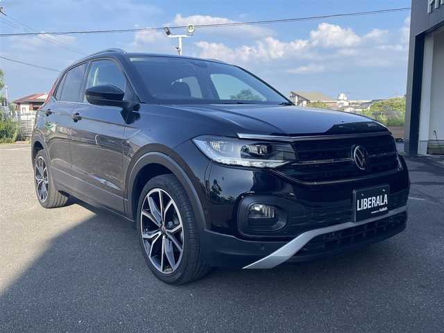 フォルクスワーゲン Ｔ－クロス TSI スタイル 宮崎県 2022(令4)年 3.4万km 黒 純正メモリナビゲーション/・Bluetooth/・社外フルセグテレビ （走行中不可）/・USB/・AM FM/ハーフレザーシート/バックカメラ/・前後コーナーセンサー/アクティブクルーズコントロール/・レーンキープ/アイドリングストップ/ブラインドスポットモニター/プッシュスタート/ETC/LEDヘッドライト/・オートライト/・オートハイビーム/前後ドライブレコーダー/純正18インチアルミホイール
