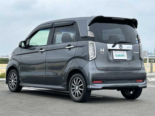 ホンダ Ｎ ＷＧＮ カスタム G Aパッケージ 佐賀県 2015(平27)年 5.2万km ポリッシュドメタルメタリック ワンオーナー/クルーズコントロール/シティブレーキアクティブシステム(CTBA)/純正メモリナビ/・ワンセグTV　CD　DVD　SD　BT/バックカメラ/ETC/ハーフレザーシート/革巻きステアリング/ステアリングリモコン/キセノンヘッドライト/プッシュスタート/スマートキー/フォグライト/ウィンカーミラー/純正14インチアルミ/純正ドアバイザ―/新車保証書/取扱説明書/スペアキー１本