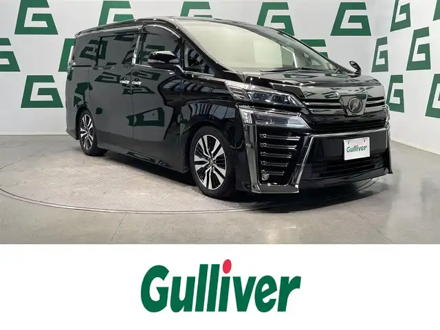 トヨタ ヴェルファイア Z Gエディション 鹿児島県 2019(平31)年 4.6万km バーニングブラッククリスタルシャインガラスフレーク 純正ナビ/(フルセグTV/Bluetooth/DVD/CD)/バックカメラ/両側パワースライドドア/クルーズコントロール/前席シートヒーター/シートベンチレーション/1/2列目パワーシート/オットマン/運転席シートメモリ/Toyota Safety Sense/　・プリクラッシュセーフティ/　・レーダークルーズコントロール/　・レーントレーシングアシスト/　・ロードサインアシスト/　・アダプティブハイビームシステム/　・インテリジェントクリアランスソナー/ドライブレコーダー/ETC/ステアリングヒーター/電動パーキングブレーキ/オートブレーキホールド/ロールサンシェード/純正アルミホイール/純正フロアマット/電動格納ミラー
