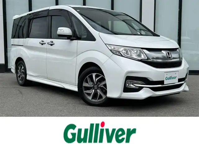 ホンダ ステップワゴン スパーダ ホンダセンシング 大阪府 2017(平29)年 4.9万km ホワイトオーキッドパール 純正ナビ　/   フルセグＴＶ/CD/DVD/Bluetooth　/バックモニター　/ホンダセンシング　/９インチ後席モニター　/両側パワースライドドア　/アイドリングストップ/パドルシフト/純正16インチアルミホイール/純正フロアマット（1列目）/Clazzioマット（2列目）　/プッシュスタート/スマートキー　/ビルトインＥＴＣ　/ＬＥＤ