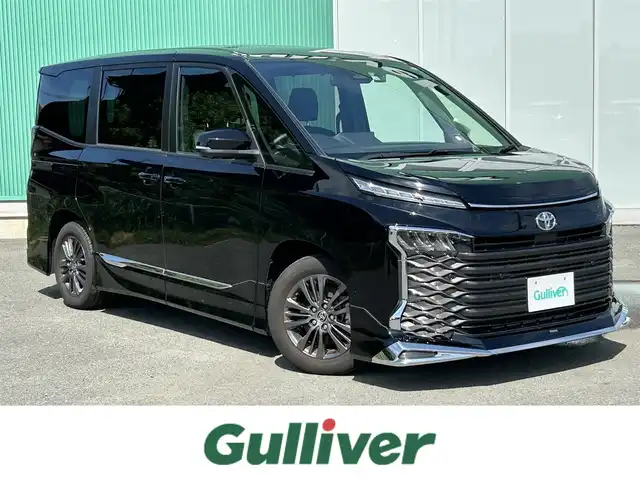 トヨタ ヴォクシー S－G 福岡県 2022(令4)年 1.4万km アティチュードブラックマイカ プッシュスタートボタン/スマートキー/クルーズコントロール/純正ナビ/Bluetoothオーディオ/USB接続/全方位カメラ/ETC2.0/前後ドライブレコーダー/純正フロアマット/純正アルミホイール/モデリスタエアロ/LEDヘッドライト/運転席・助手席シートヒーター