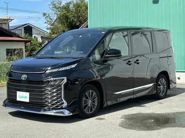 トヨタ ヴォクシー S－G 福岡県 2022(令4)年 1.4万km アティチュードブラックマイカ プッシュスタートボタン/スマートキー/クルーズコントロール/純正ナビ/Bluetoothオーディオ/USB接続/全方位カメラ/ETC2.0/前後ドライブレコーダー/純正フロアマット/純正アルミホイール/モデリスタエアロ/LEDヘッドライト/運転席・助手席シートヒーター