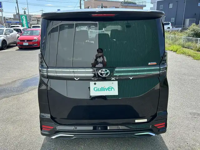トヨタ ヴォクシー S－G 福岡県 2022(令4)年 1.4万km アティチュードブラックマイカ プッシュスタートボタン/スマートキー/クルーズコントロール/純正ナビ/Bluetoothオーディオ/USB接続/全方位カメラ/ETC2.0/前後ドライブレコーダー/純正フロアマット/純正アルミホイール/モデリスタエアロ/LEDヘッドライト/運転席・助手席シートヒーター