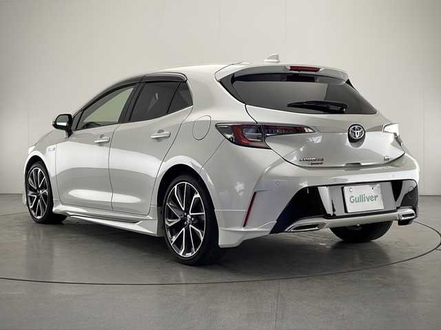 トヨタ カローラ スポーツ ハイブリッドG Z 宮崎県 2019(平31)年 3.9万km ホワイトパールクリスタルシャイン 禁煙車/トヨタセーフティセンス/純正ナビTV/（NSZT-W68T/CD/Bluetooth/FMAM/フルセグTV)/純正バックカメラ/純正ビルトインETC/純正モデリスタエアロ/純正エンジンスターター/純正LEDオートライト/純正LEDフォグ/純正18インチアルミ/純正フロアマット/社外前後ドライブレコーダー（コムテック）/アダプティブクルーズコントロール/プリクラッシュセーフティ/レーンディパーチャーアラート/オートマチックハイビーム/クリアランスソナー/電子パーキング/オートホールド/ウインカードアミラー/デュアルオートエアコン/本革巻ハンドル/スマートキー/プッシュエンジンスタート/スペアキー/新車時保証書/取扱い説明書