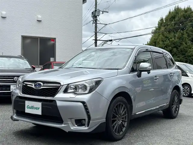 スバル フォレスター 2．0XT アイサイト 熊本県 2013(平25)年 10.4万km アイスシルバーメタリック ワンオーナー/STI18インチアルミホイール/STIスタビライザー/STIタワーバー/STIシフトノブ/4WD/ターボ/社外メモリナビ(AVIC-ZH0009)/【フルセグTV/SD/Bluetooth/CD/DVD】/バックカメラ/衝突被害軽減システム/レーダークルーズコントロール/レーンキープアシスト/ダウンヒルアシストコントロール/ハーフレザシート/革調シートカバー/前席パワーシート/前席シートヒーター/PROVAブルーミラー/オートLEDライト/ビルトインETC/横滑り防止装置/盗難防止装置/純正フロアマット/プッシュスタート/スマートキー/スペアキー/ベンチシート/取扱説明書/保証書