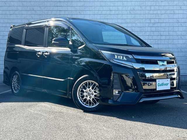 トヨタ ノア ハイブリッド Si ダブルバイビー 大阪府 2018(平30)年 5.9万km ブラック 純正10インチナビ（フルセグ/BT/DVD/CD)/純正後席モニター/両側パワースライドドア/衝突被害軽減システム/横滑り防止装置/レーンキープアシスト/オートマチックハイビーム/クルーズコントロール/アイドリングストップ/シートヒーター/ハーフレザー/純正AW(16inch)/純正LEDライト/純正フロアマット/ビルトインETC/ドライブレコーダー/スペアキー1本
