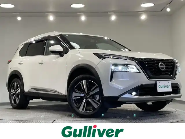 日産 エクストレイル G e－4ORCE 愛知県 2023(令5)年 1.4万km ブリリアントホワイトパール 12.3in日産コネクトナビ　/(アラウンドビュー/AppleCarPlay/Bluetooth)/プロパイロットパーキング/プロパイロット　/デジタルインナーミラー　/ＡＣ１００Ｖ電源　/置くだけ充電　/ドライブレコーダー　/ＥＴＣ２．０　/ブラインドスポットモニター　/ヘッドアップディスプレイ/シートメモリー　/シートヒーター/パワーバックドア/衝突被害軽減ブレーキ