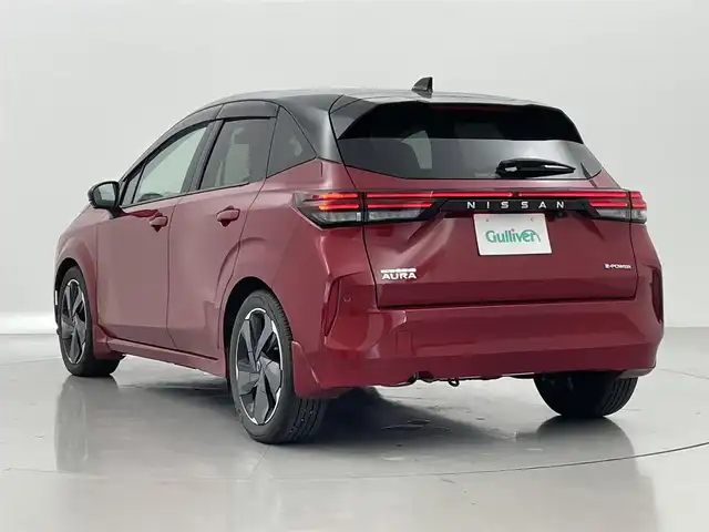日産 オーラ G レザーエディション 熊本県 2021(令3)年 3.9万km ガーネットレッド/スーパーブラック 2トーン 純正9インチナビ/(ApplCarPlay・AndroidAuto・Bluetooth・フルセグ・USB・HDMI)/アラウンドビューモニター/BOSEパーソナルプラス/デジタルルームミラー/レザーシート/ワイヤレス充電/純正前方ドライブレコーダー/ビルトインETC2.0/前後クリアランスソナー/ブラインドスポットモニター/エマージェンシーブレーキ/プロパイロット/インテリジェントクルーズコントロール/ハンドル支援/側方・後方支援/駐車支援/標識認識機能/踏み間違い防止/ハイビームアシスト/オートライト/LEDヘッドライト/フォグランプ/スマートキー/プッシュスタート/スペアキー1本/保証書/取扱説明書