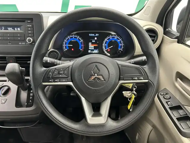 三菱 ｅＫワゴン M 鹿児島県 2024(令6)年 0.7万km スターリングシルバーM 純正オーディオ　/ミラー型バックカメラ　/ＵＳＢソケット　/ヘッドライトレベライザー　/ステリモ　/社外フロアマット　/アイドリングストップ　/カーテンエアバッグ　/ハロゲンライト　/ベンチシート/DN席シートヒーター/パワーステアリング/パワーウィンドウ/衝突被害軽減システム/AUX接続