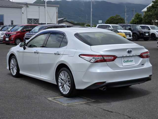 トヨタ カムリ G レザーパッケージ 鹿児島県 2018(平30)年 7.1万km プラチナホワイトパールマイカ アダプティブクルーズコントロール　/ビルトインＥＴＣ２．０　/Ｄ＋Ｎ席シートヒーター　/Ｄ＋Ｎ席パワーシート　/純正ＳＤナビ　/Ｂｌｕｅｔｏｏｔｈオーディオ　/ＭＴモード付きＡＴ　/ヘッドアップディスプレイ/テレビキャンセラー/フルレザーシート/トヨタセーフティセンス/インテリジェントクリアランスソナー/横滑り防止装置/レーンキープアシスト/エアバッグ(W+サイド)/カーテンエアバッグ/プッシュスタート/スマートキー/アイドリングストップ/純正アルミホイール(18インチ)