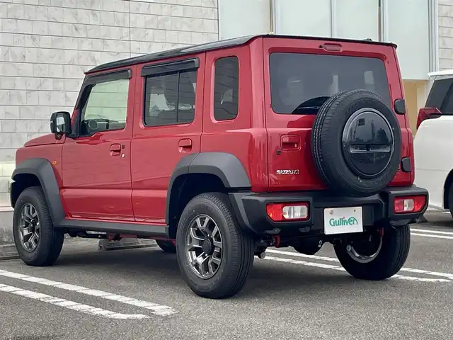 スズキ ジムニー ノマド FC 宮崎県 2025(令7)年 0.1千km 赤 ワンオーナー/４WD/衝突軽減ブレーキ/レーンキープアシスト/レーダークルーズコントロール/LEDヘッドライト/フォグランプ/シートヒーター/スマートキー/プッシュスタート/アイドリングストップ/背面タイヤ