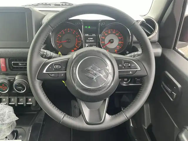 スズキ ジムニー ノマド FC 宮崎県 2025(令7)年 0.1千km 赤 ワンオーナー/４WD/衝突軽減ブレーキ/レーンキープアシスト/レーダークルーズコントロール/LEDヘッドライト/フォグランプ/シートヒーター/スマートキー/プッシュスタート/アイドリングストップ/背面タイヤ