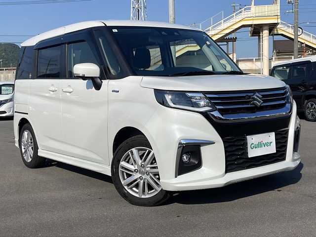 スズキ ソリオ HV MZ 山口県 2023(令5)年 1.2万km ピュアホワイトP 純正メモリナビ/・フルセグTV/・Bluetooth接続/全方位カメラ/アダプティブクルーズコントロール/レーダーブレーキサポート/シートヒーター(D席/N席)/LEDヘッドライト/オートライト/純正15インチアルミホイール/ドアバイザー/ETC