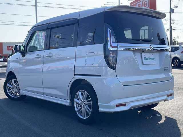 スズキ ソリオ HV MZ 山口県 2023(令5)年 1.2万km ピュアホワイトP 純正メモリナビ/・フルセグTV/・Bluetooth接続/全方位カメラ/アダプティブクルーズコントロール/レーダーブレーキサポート/シートヒーター(D席/N席)/LEDヘッドライト/オートライト/純正15インチアルミホイール/ドアバイザー/ETC